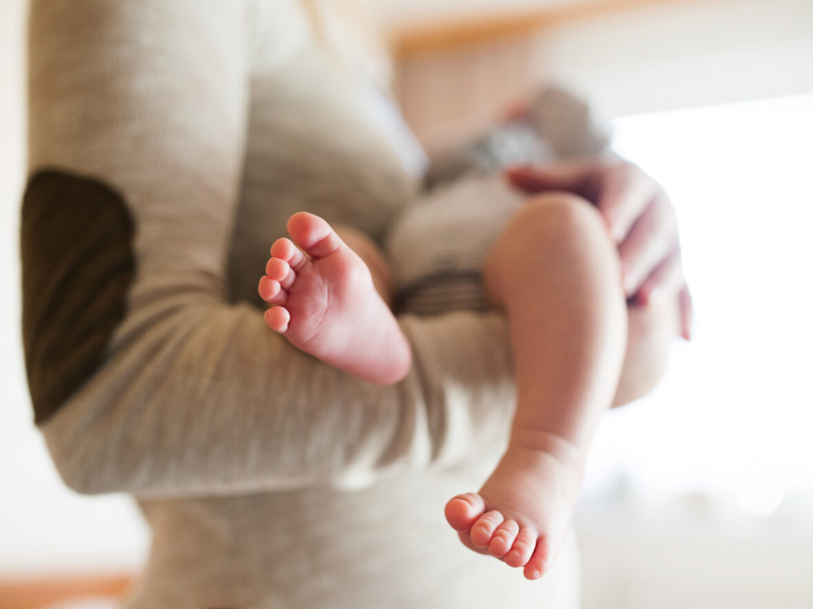 A woman holding a baby